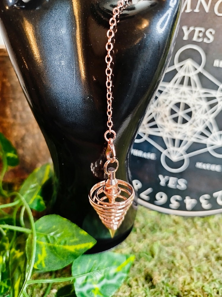 Pendule divinatoire rose doré en spirale