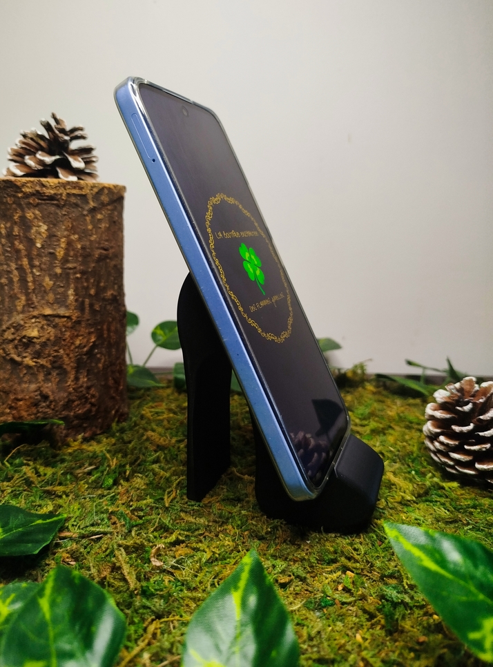 Support téléphone en forme de talon haut noir