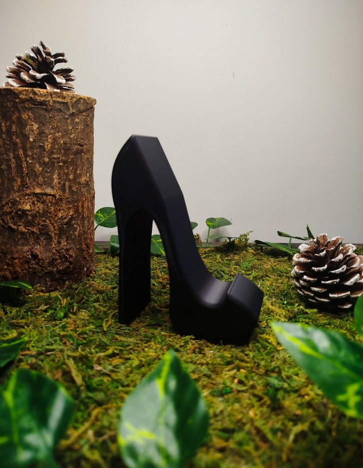 Support téléphone en forme de talon haut noir